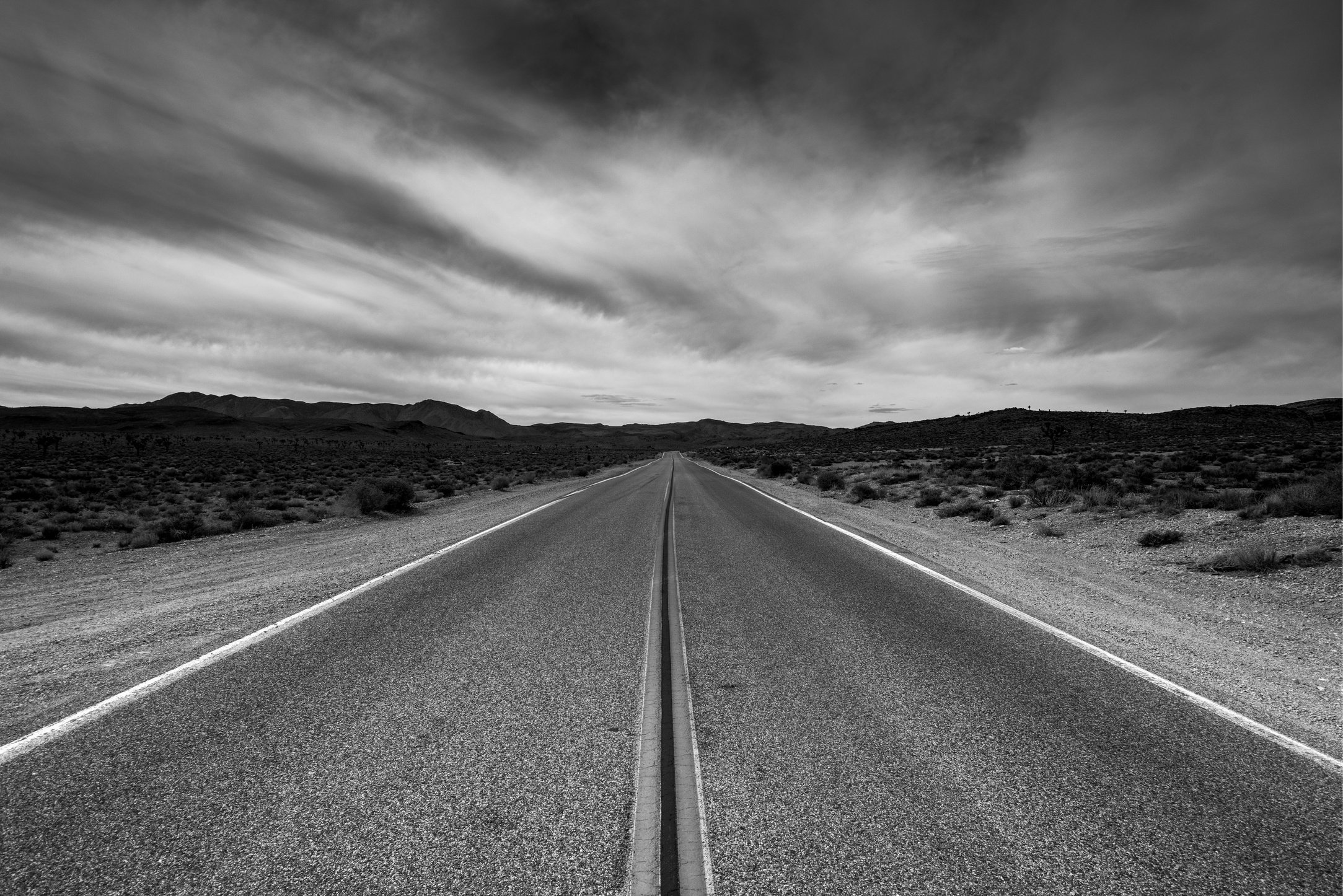 Black and White Photo of an Empty Road